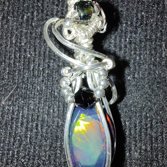 Sterling silver wire wrapped genuine black faceted Ethiopian opal pendant - Picture 4 of 9